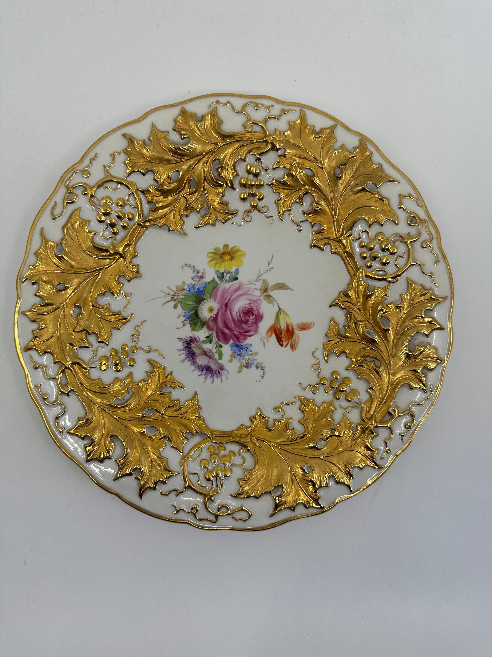 Antique Meissen Porcelain gilded charger: Meissen Porcelain charger, late 19th century, 10" diameter. Heavily gilded charger with hand painted flowers.Condition: Excellent Condition, no chips or cracks.