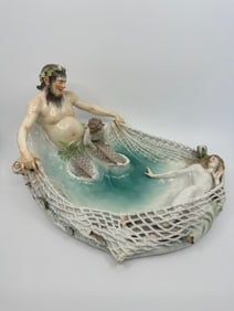 A MEISSEN FIGURE GROUP OF A NYMPH BEING CAPTURED, 'TRITONENFANG'