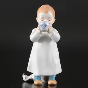 A Meissen Porcelain Figure of a Boy Drinking From Cup