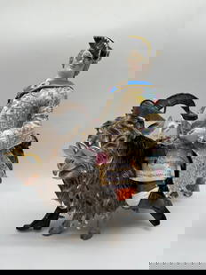 A MEISSEN LARGE FIGURE OF COUNT VON BRUHL'S TAILOR, SECOND-HALF 19TH CENTURY: A MEISSEN LARGE FIGURE OF COUNT VON BRUHL'S TAILOR, SECOND-HALF 19TH CENTURY after the 18th century model by J. J. Kaendler, brightly painted wearing a yellow floral frock coat, seated astride a shagg