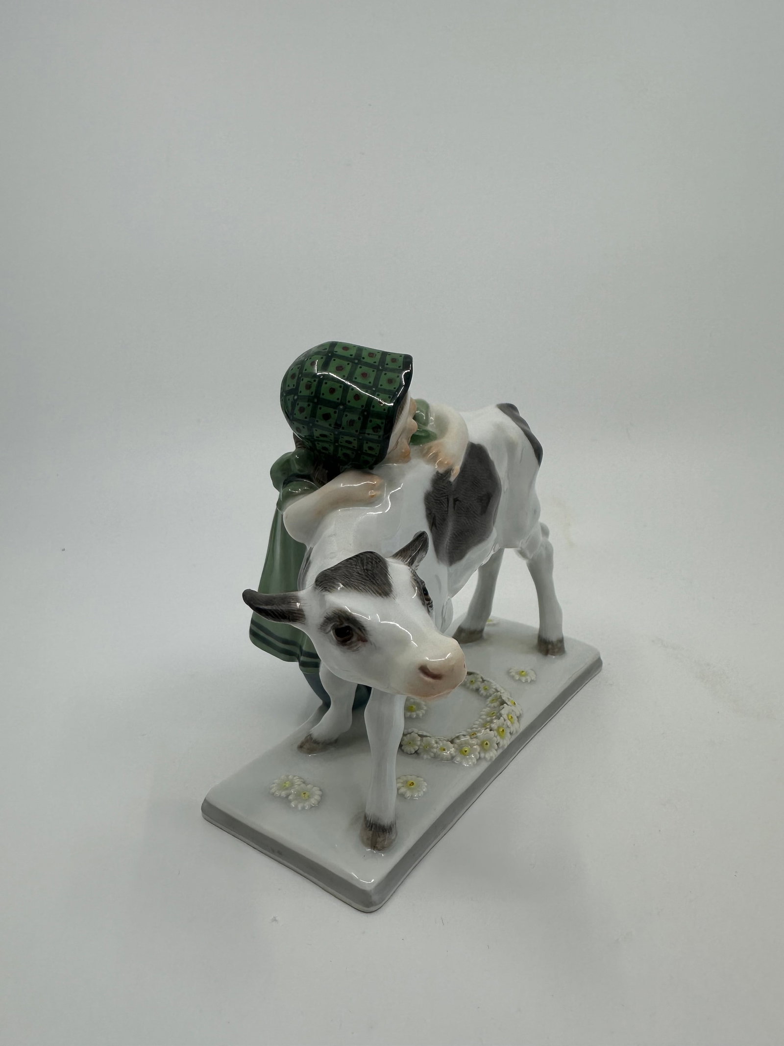 ANTIQUE ART NOUVEAU MEISSEN PORCELAIN FIGURE OF GIRL WITH COW: Description Girl with cow, designed by Bochman 1905-1910, Meissen Blue crossed swords, impressed mark Y191.5 x 5.5 in. Condition Report Excellent condition, no chips or cracks
