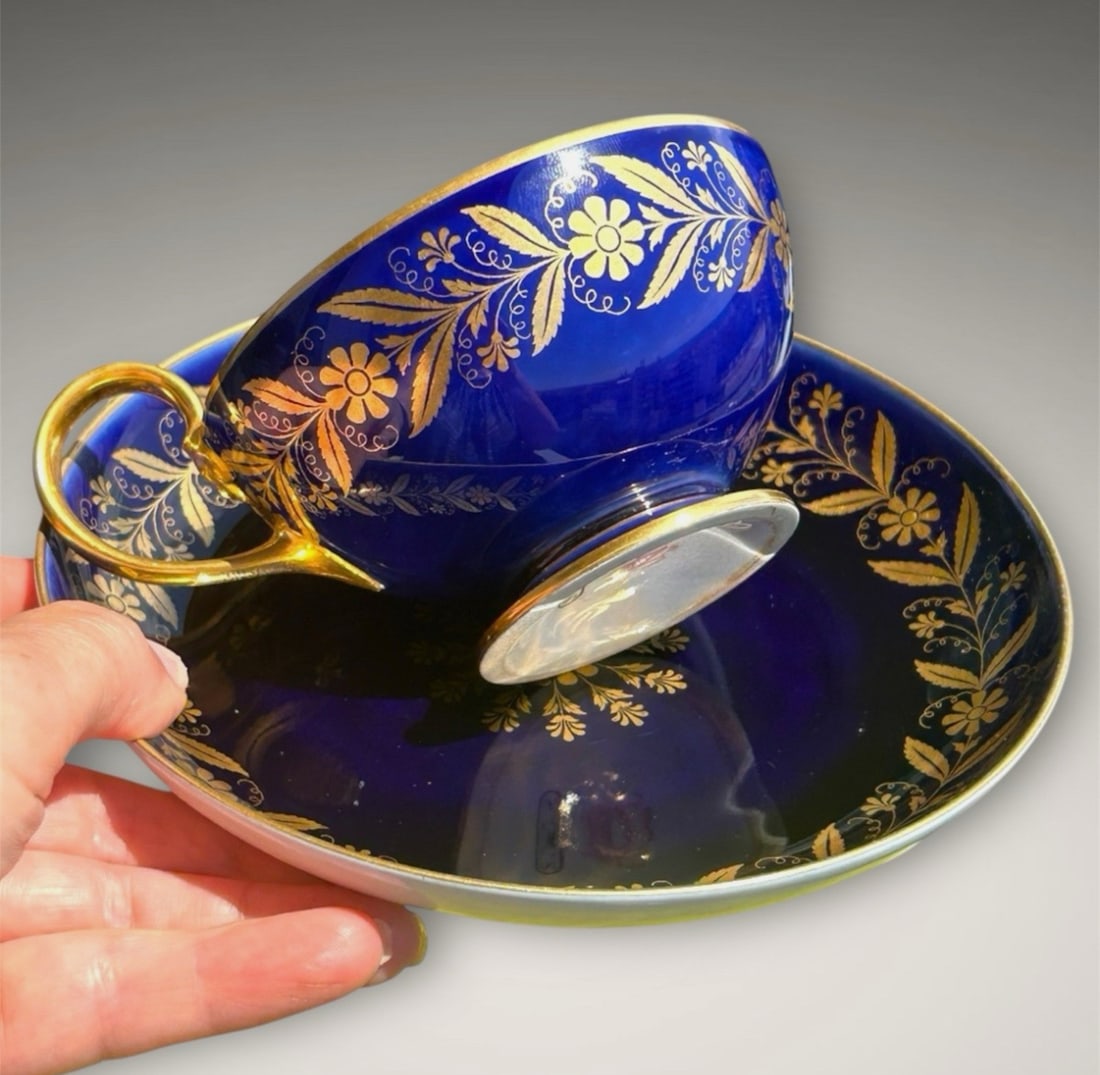Antique sevres porcelain cup and saucer: Description Tea cup and saucer, Sevres, Napoleon mark . 1860, volute handle ending in a palmette, ornamental gilding on cobalt background, h. 5,5 cm diameter 10 cm saucer 15 cm Condition Report Excell