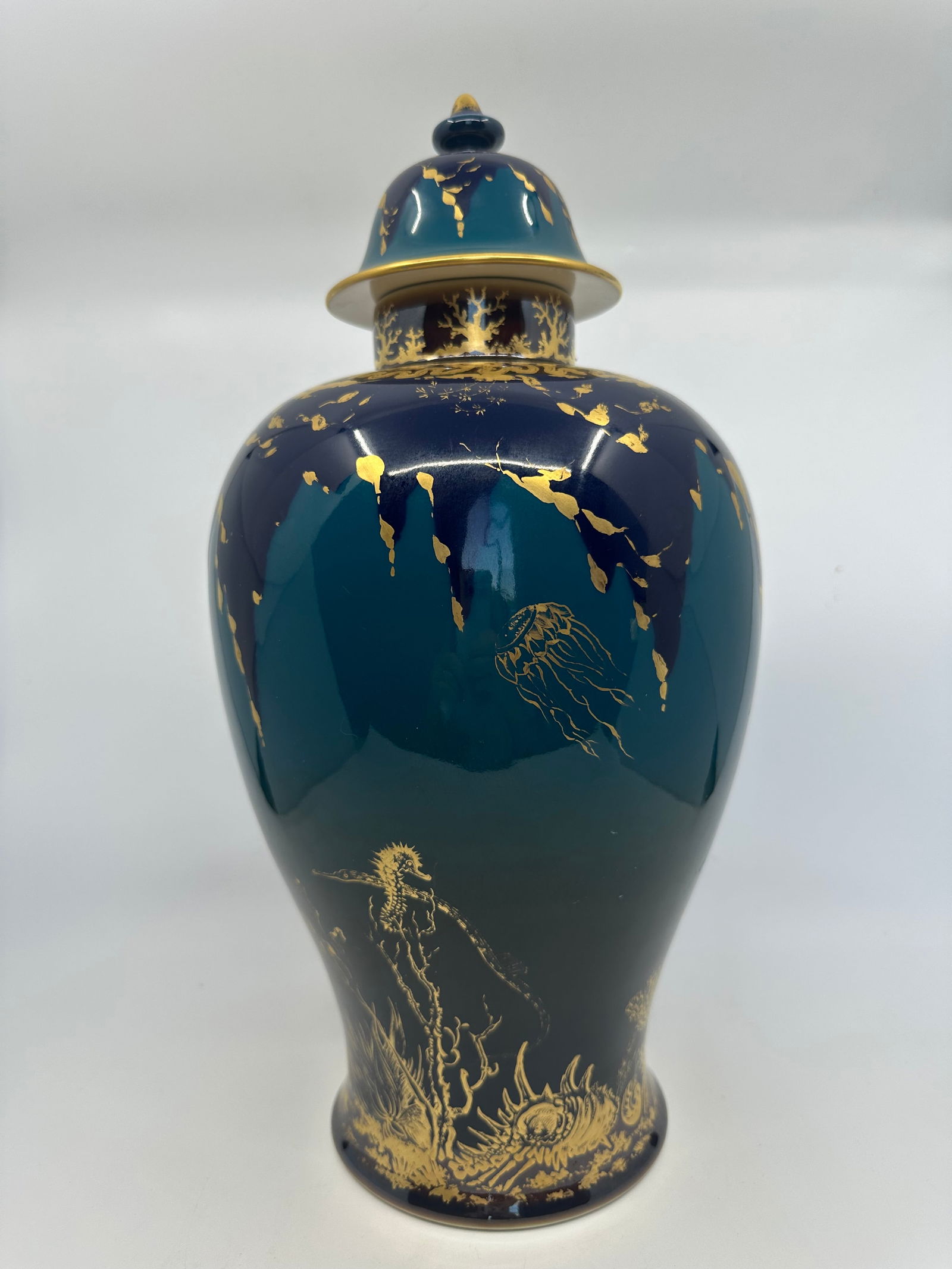 Royal Berlin KPM Porcelain 16" Gold Painted Blue Green Covered Urn or Vas: Description Hand painted with under the sea theme, gilded jellyfish, seahorse and corals, stunning blue green color throughout. The cover having gilt finial. Height 16" Marked underfoot. circa 1900. C