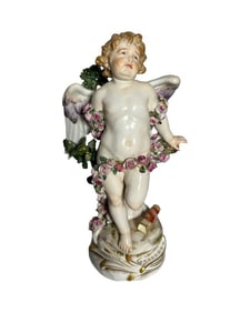 Antique Meissen Cupid bound by roses