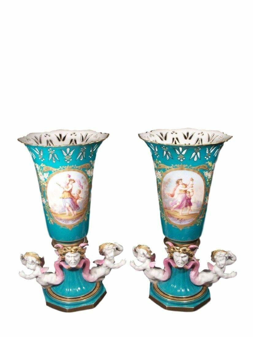 Beautiful Antique Pair of Old Paris Sevres Style Vases: A Pair of Monumental Old Pair and Gilt Porcelain Vases Trumpeted body with a tapered stem has a bisque winged Medusa head on the front and figural winged bisque cherubs on wither side with serpent-lik