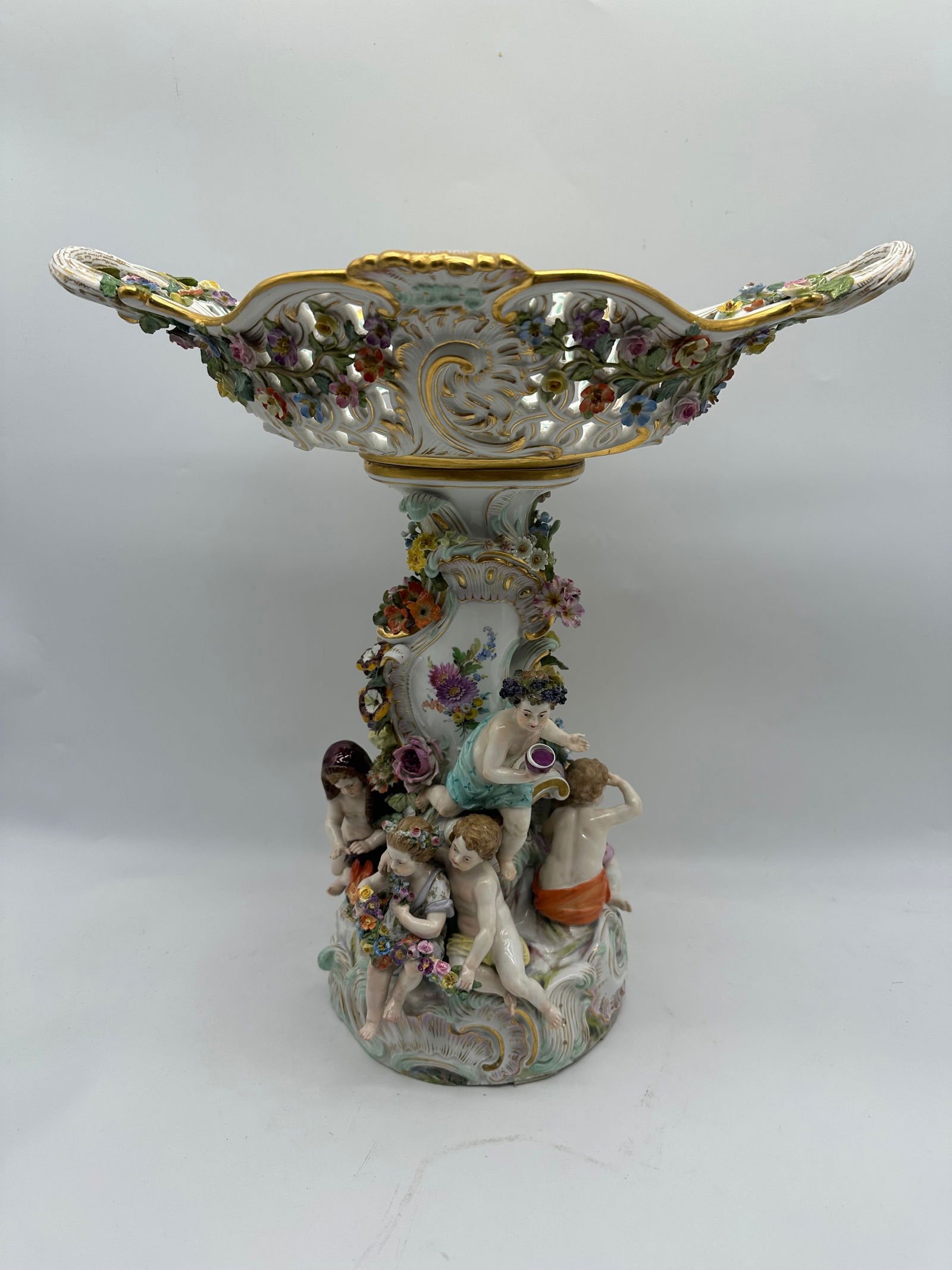 Antique Meissen centerpiece: A MEISSEN RETICULATED CENTERPIECES AND STANDS, EMBLEMATIC OF THE FOUR SEASONSCIRCA 1880, BLUE CROSSED SWORDS MARKS, ALL INCISED 605., VARIOUS IMPRESSED NUMERALS, MODELLED BY LEUTERITZ In the Rococo ta