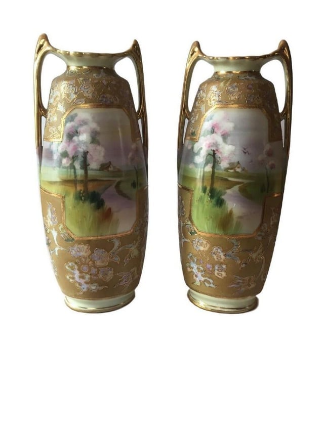 Rare Nippon Green M in wreath Pair of Vases: Rare Nippon Green M in wreath pair of buttress foot vases with a pastoral river landscape with raised gilt decoration. Height 13" Condition: No Chips and No Cracks , Excellent Condition.