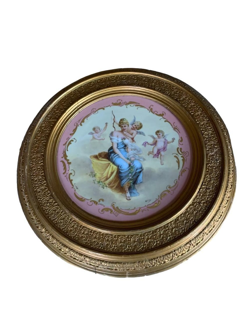 Antique Royal Vienna Porcelain Portrait Hand Painted Charger: ANTIQUE ROYAL VIENNA HAND PAINTED PORTRAIT PLATE Late 19th Century, tilted and impressed maker's markFinely hand painted scene depicts a female surrounded by cherubs. Pink and gilt borders.Diameter: 1