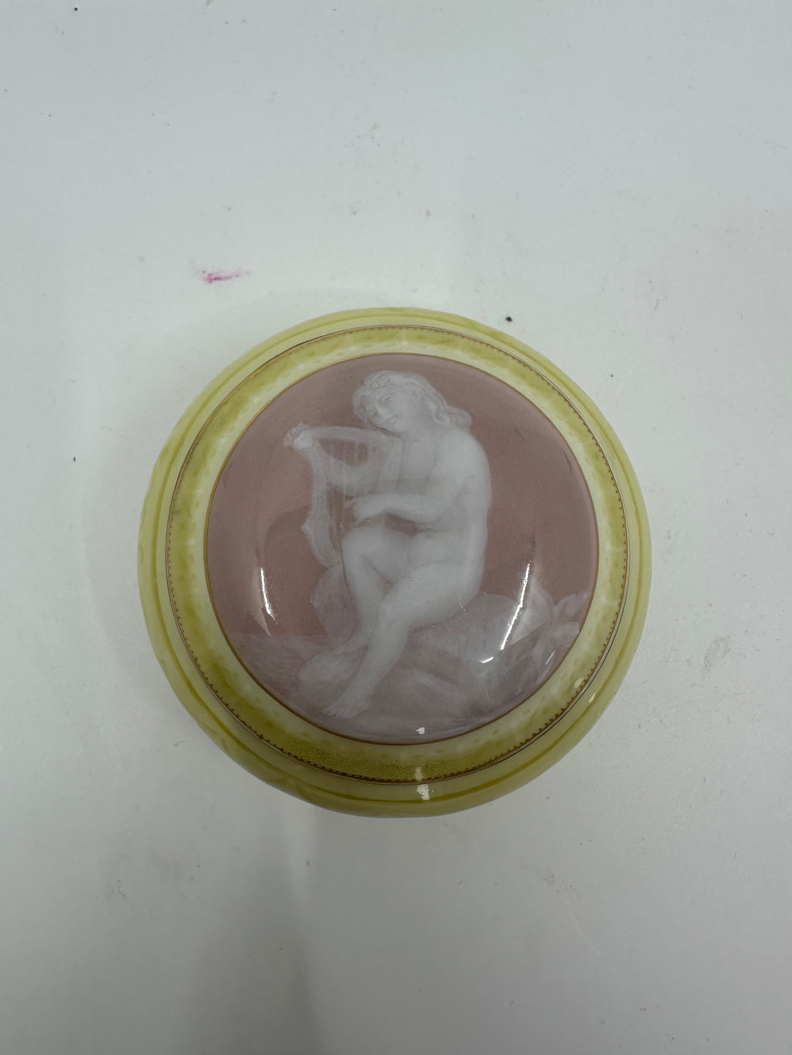 Antique Stunning Lemon colored Meissen box with a cameo portrait in Pate-sur-pate: Beautifully modeled and extremely finely painted in lemon color along with a portrait of a muse in Pate-sur-pate . Gold details on the cover surrounding the portrait cameo and incised details througho