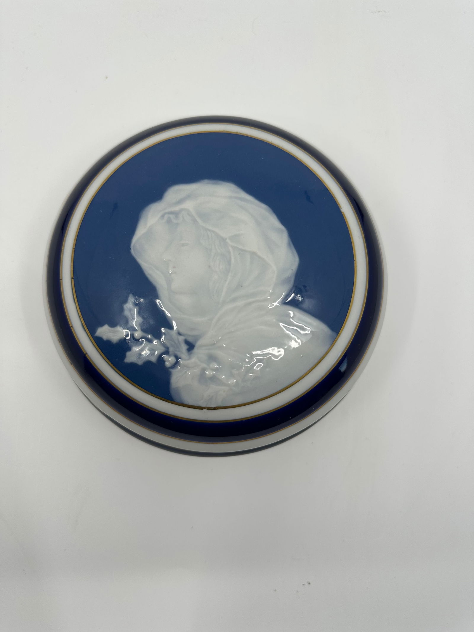 Camille Tharaud Limoges Pate Sur Pate Box: DESCRIPTION: A Camille Tharaud Limoges porcelain, pate sur pate box. Features an embossed cameo of a veiled nymph wielding a flower. Finished with gilded trims. Marked along the underside:"Tharaud Lim