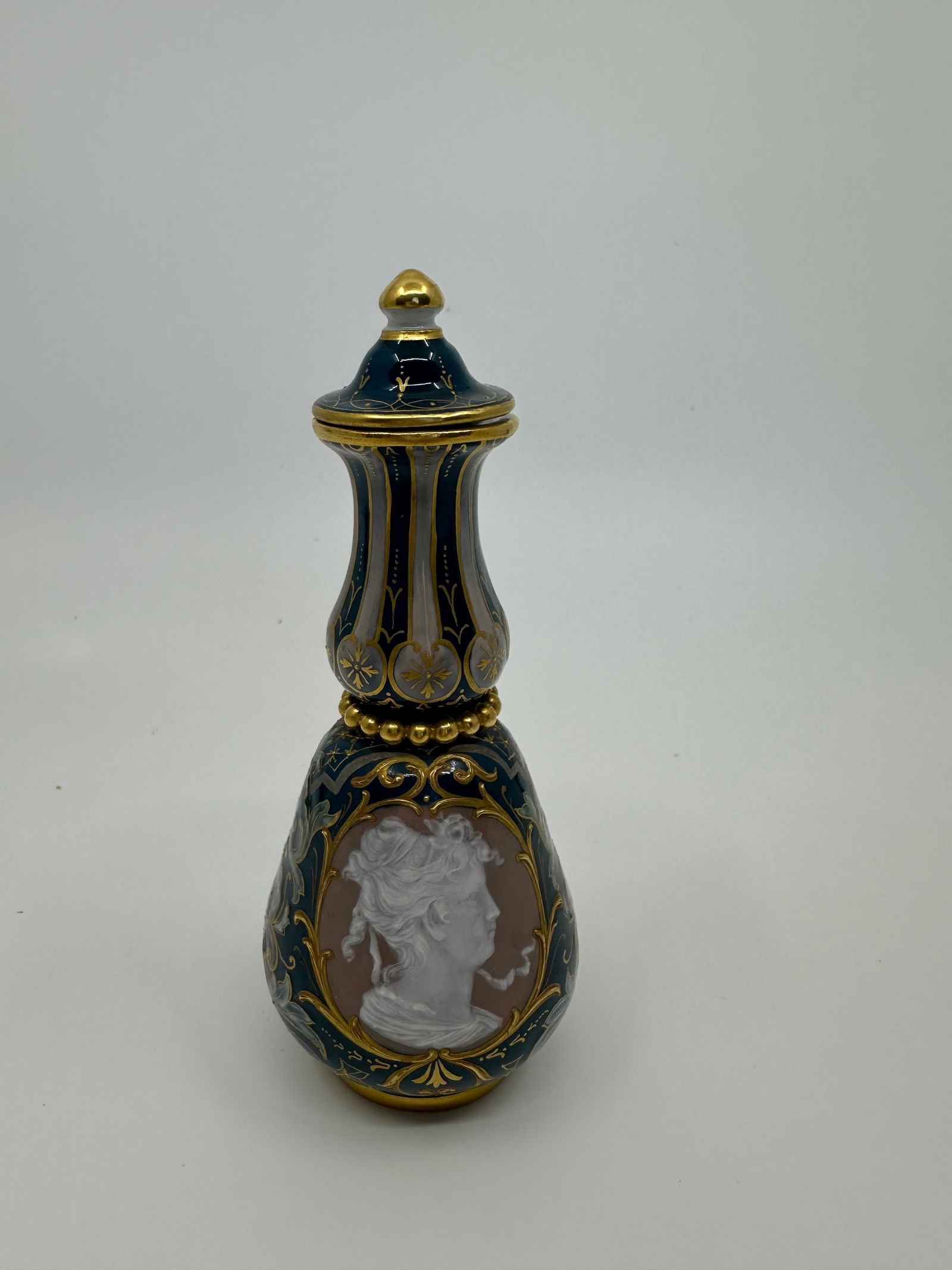 Rare Antique Meissen Porcelain pate sur pate scent bottle: Description A MEISSEN TEAL-GROUND PATE-SUR-PATE SCENT-BOTTLE AND STOPPER LATE 19TH CENTURY, BLUE CROSSED SWORDS MARK Of double gourd form with mythic beast handle, the vase bisected by a beaded 'pearl