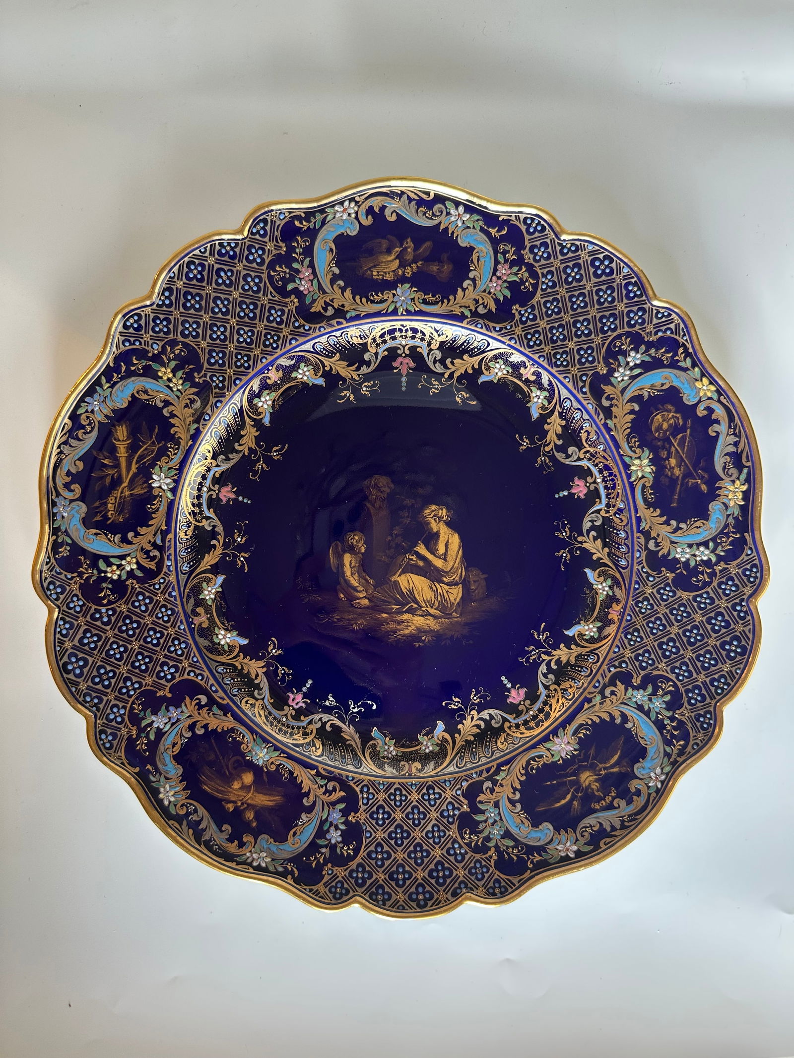 Rare Meissen porcelain antique cobalt ground enameled charger limoges style: Meissen porcelain antique cobalt ground charger with gilt hand painted mythological scene. Multicolor enamels on the entire charger. Exceptional Gold and Platinum painted details in Limoges enamel sty