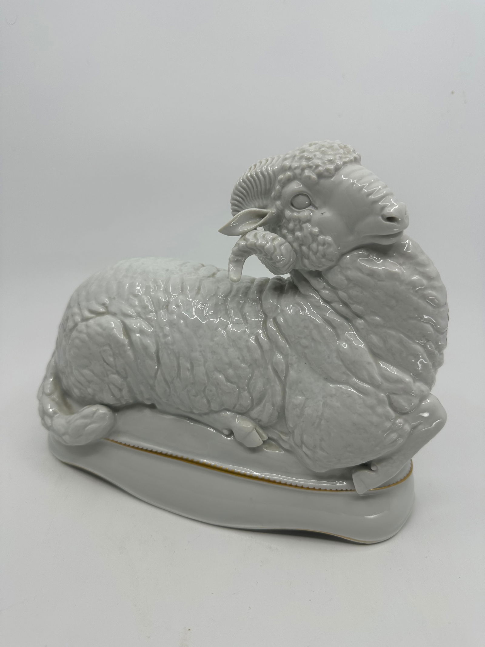 Meissen Max Esser (Barth 1885-1945 Berlin), A ram from the centrepiece ?Reineke Fuchs?: Designed in 1925, executed by Meissen Porcelain Factory before 1934, porcelain, inscribed in gold M. Esser 1925, with crossed swords mark with dot and model no. H 262, height 19 cm, length 22.5 cm,.
