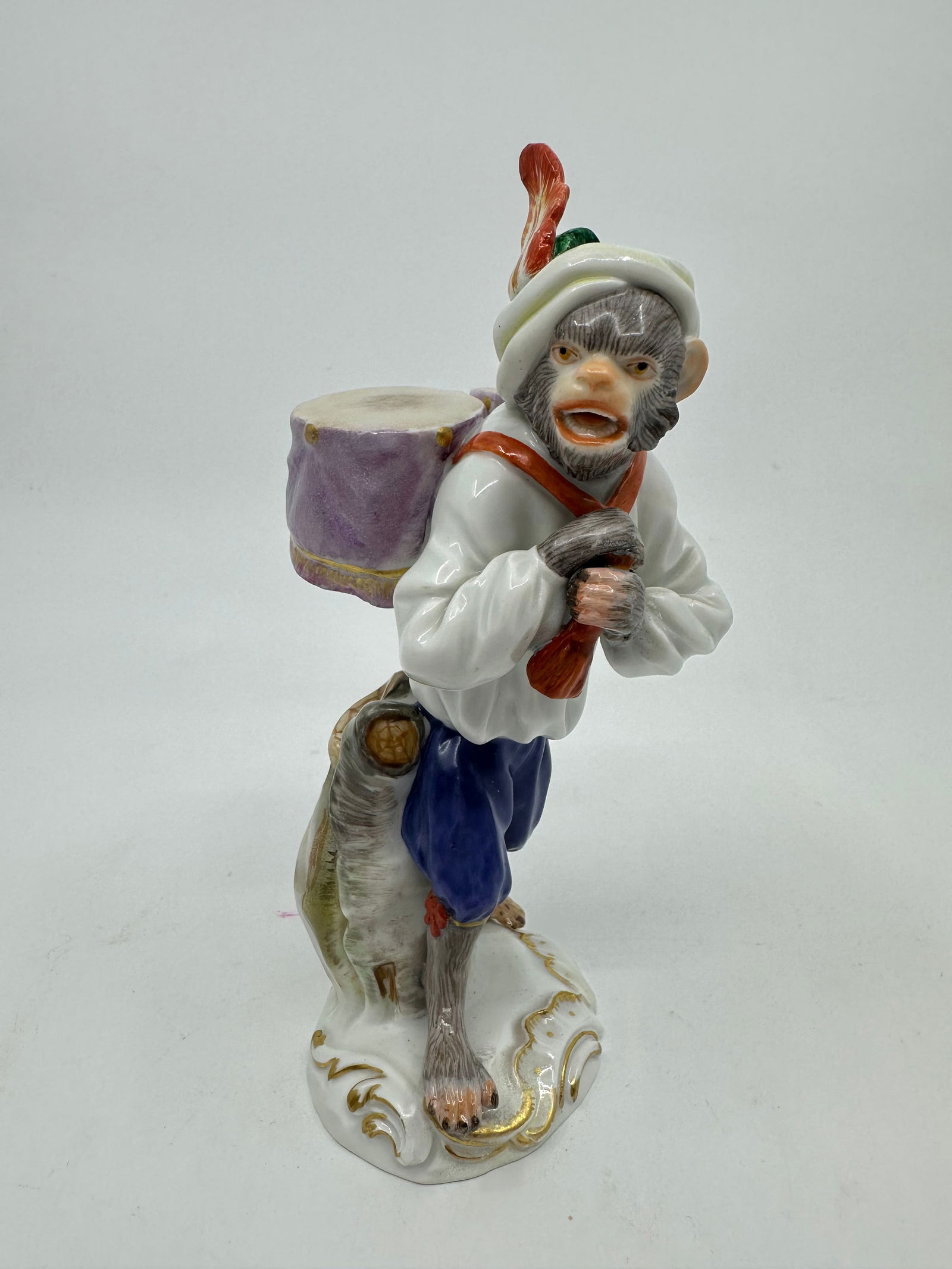 Meissen porcelain monkey band figure: Meissen monkey band member with drums.Properly marked with Meissen crossed swords.Height 5 1/2 inches.