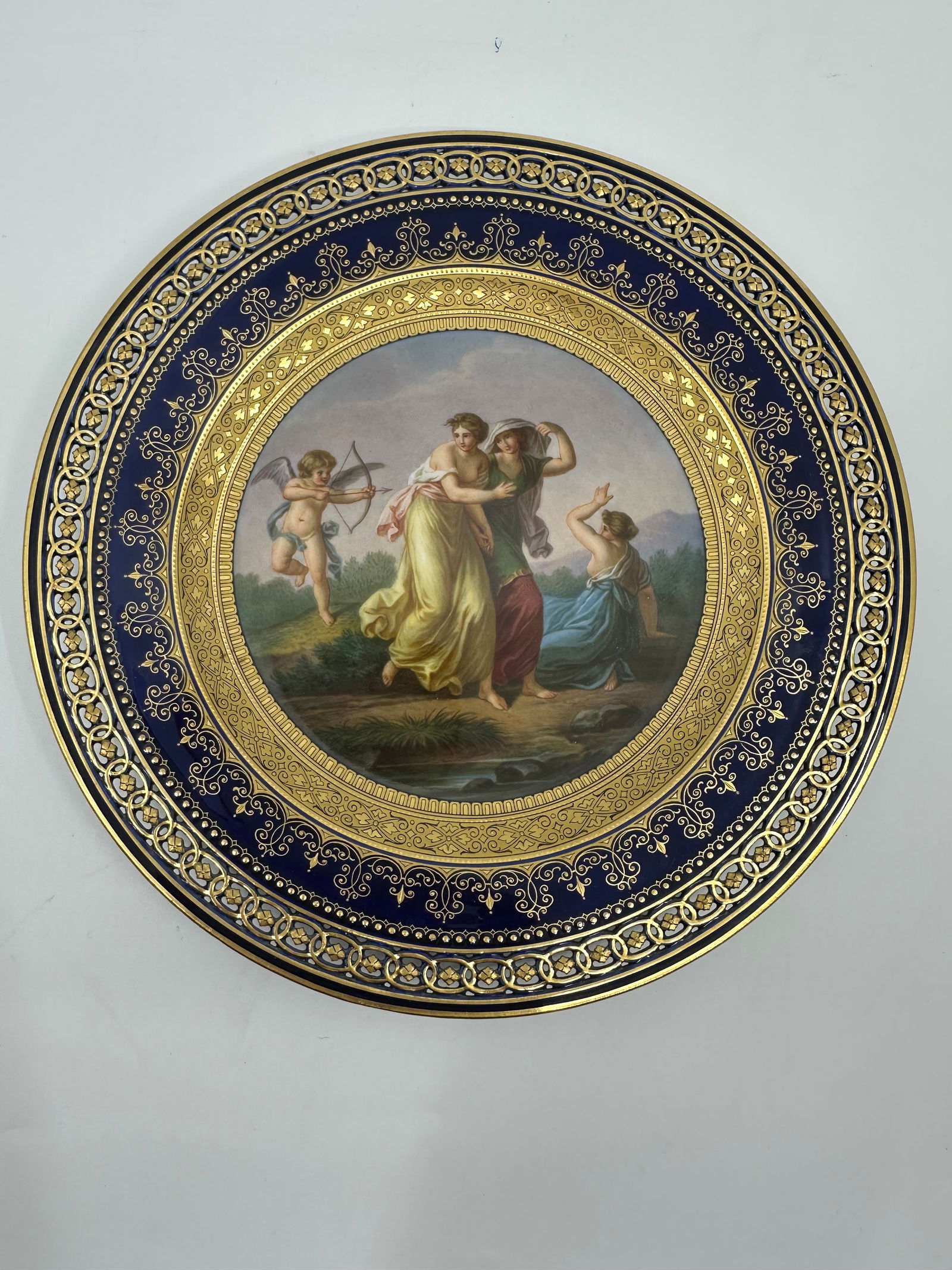 Early 19th Century Meissen Old Master A Kaufman Scenic Reticulated Gilt Plate: MEISSEN COBALT-BLUE GROUND RETICULATED CABINET PLATELate 19th century, blue crossed swords and various impressed numbers, finely painted mythological scene after Kaufman9 ¼in. (23.5cm.) diamete
