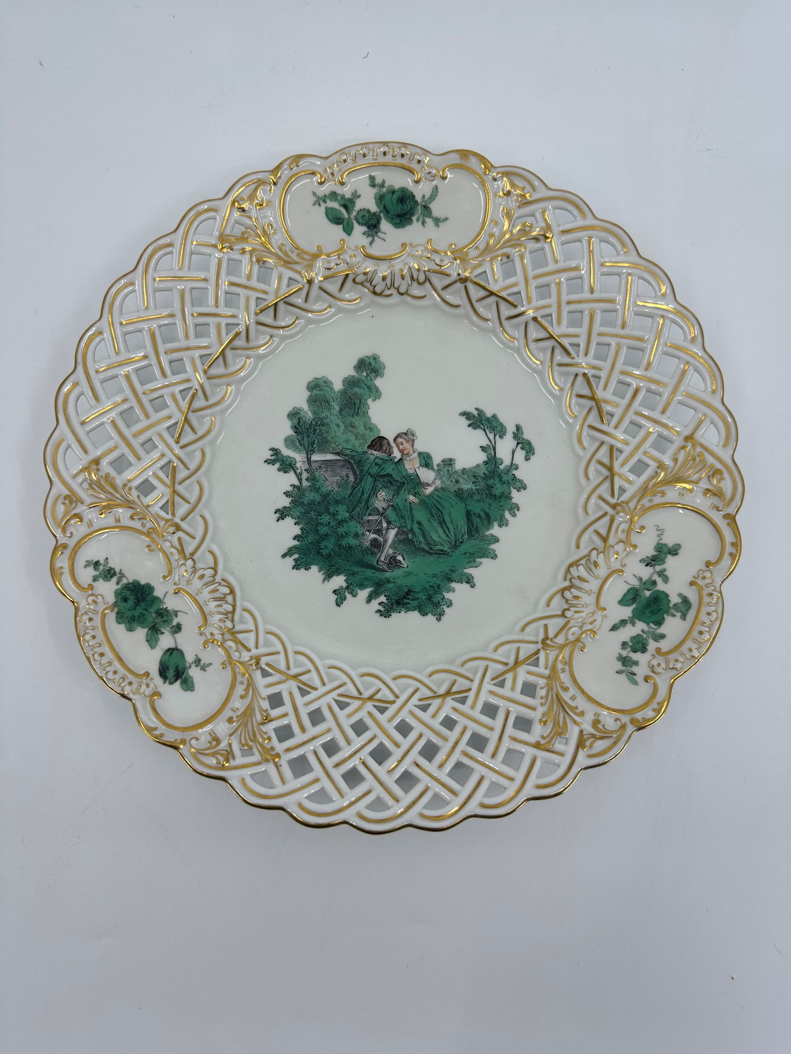 ANTIQUE MEISSEN PORCELAIN WATTEAU CABINET PLATE: ANTIQUE MEISSEN PORCELAIN CABINET PLATE. LATE 19TH CENTURY, BLUE CROSSED SWORDS MARKS, VARIOUS IMPRESSED NUMERALS. Finely painted Watteau scenes in a gilt border 9 3/4 in. diameter Condition Excellent