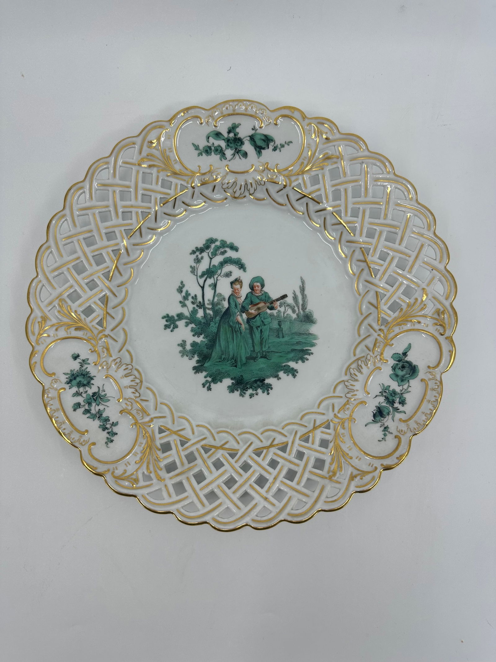 ANTIQUE MEISSEN PORCELAIN WATTEAU CABINET PLATE: ANTIQUE MEISSEN PORCELAIN CABINET PLATE. LATE 19TH CENTURY, BLUE CROSSED SWORDS MARKS, VARIOUS IMPRESSED NUMERALS. Finely painted Watteau scenes in a gilt border 9 3/4 in. diameter Condition Excellent