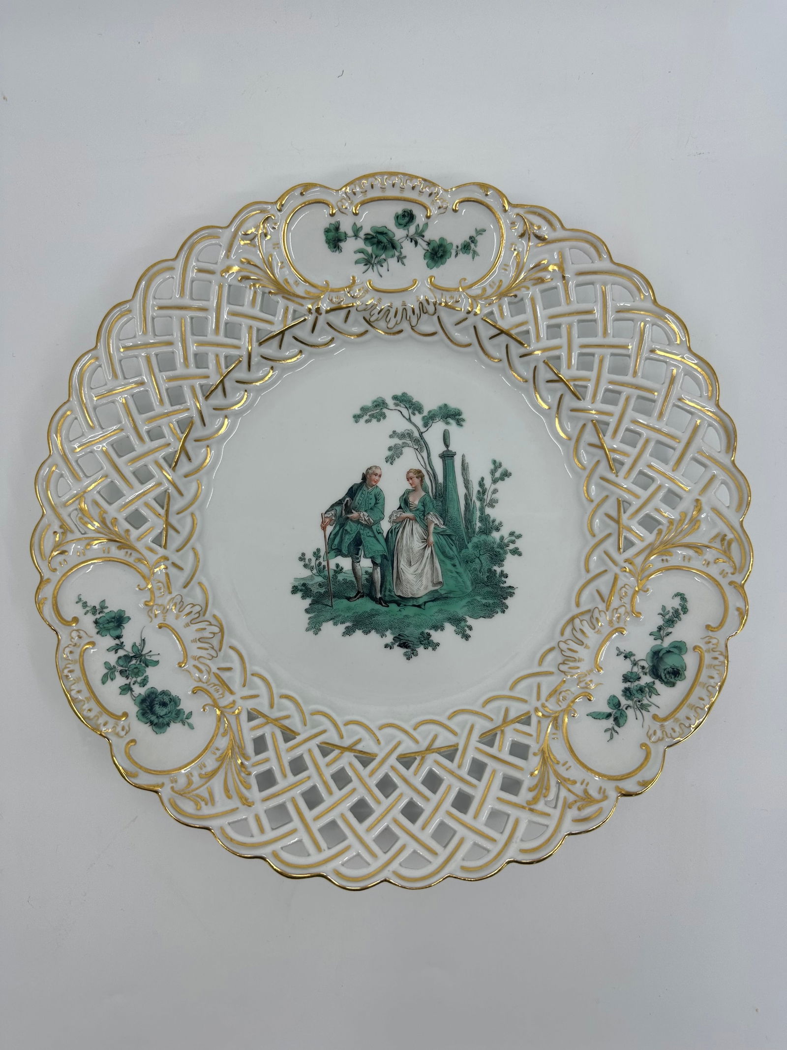 ANTIQUE MEISSEN PORCELAIN WATTEAU CABINET PLATE: ANTIQUE MEISSEN PORCELAIN CABINET PLATE. LATE 19TH CENTURY, BLUE CROSSED SWORDS MARKS, VARIOUS IMPRESSED NUMERALS. Finely painted Watteau scenes in a gilt border 9 3/4 in. diameter Condition Excellent