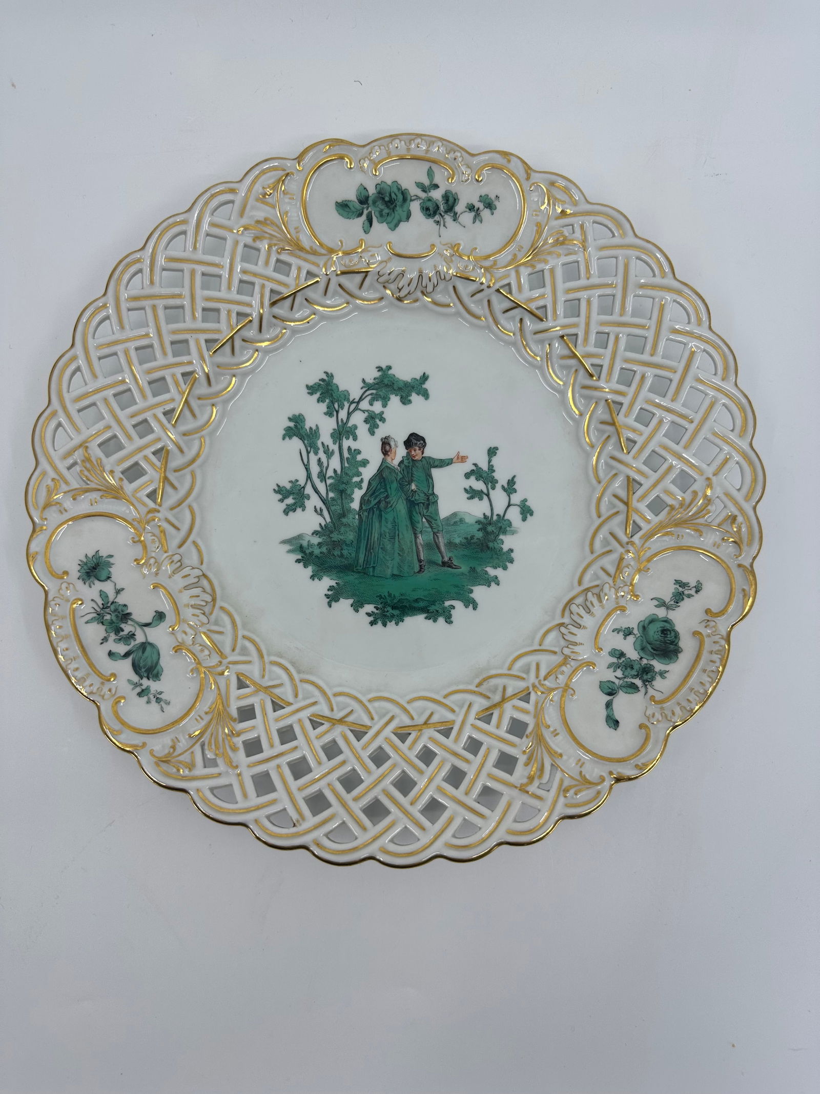 ANTIQUE MEISSEN PORCELAIN WATTEAU CABINET PLATE: ANTIQUE MEISSEN PORCELAIN CABINET PLATE. LATE 19TH CENTURY, BLUE CROSSED SWORDS MARKS, VARIOUS IMPRESSED NUMERALS. Finely painted Watteau scenes in a gilt border 9 3/4 in. diameter Condition Excellent