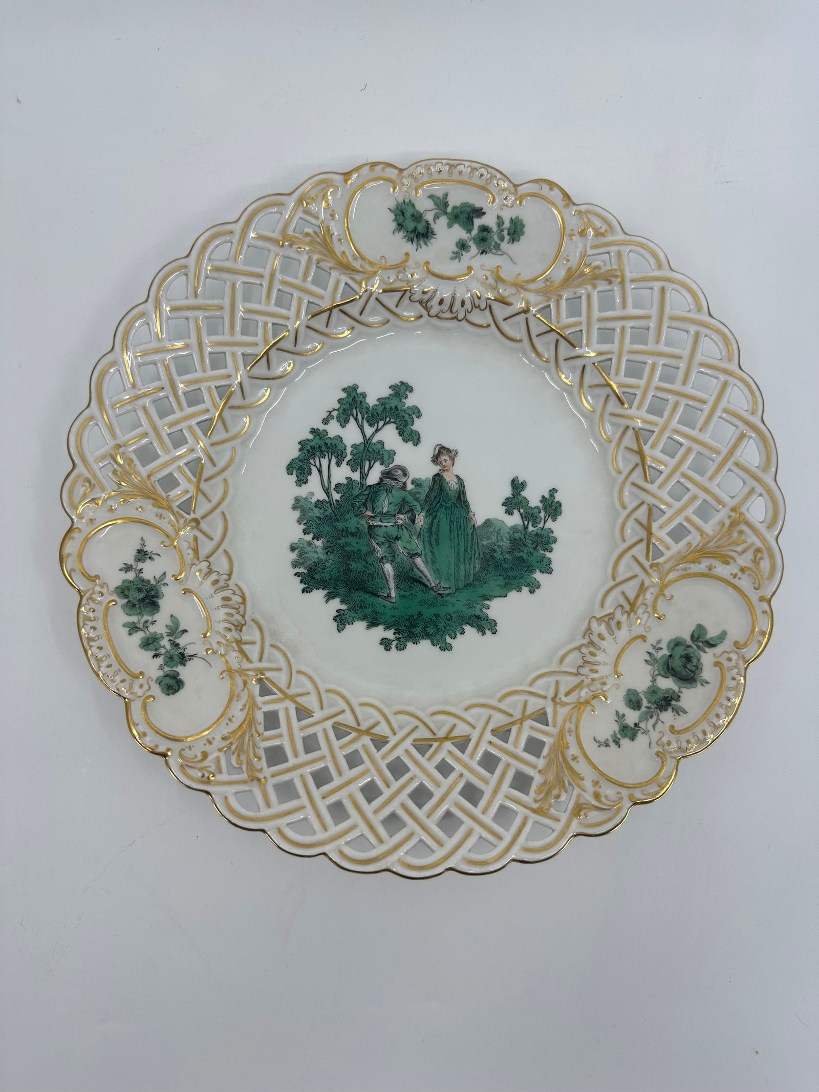 ANTIQUE MEISSEN PORCELAIN WATTEAU CABINET PLATE: ANTIQUE MEISSEN PORCELAIN CABINET PLATE. LATE 19TH CENTURY, BLUE CROSSED SWORDS MARKS, VARIOUS IMPRESSED NUMERALS. Finely painted Watteau scenes in a gilt border 9 3/4 in. diameter Condition Excellent