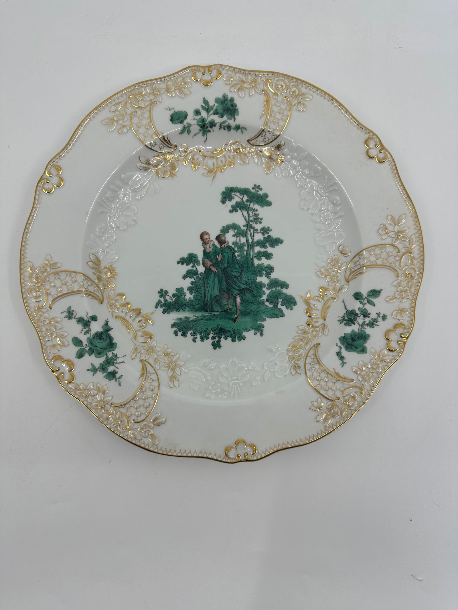 ANTIQUE MEISSEN PORCELAIN WATTEAU CABINET PLATE: ANTIQUE MEISSEN PORCELAIN CABINET PLATE. LATE 19TH CENTURY, BLUE CROSSED SWORDS MARKS, VARIOUS IMPRESSED NUMERALS. Finely painted Watteau scenes in a gilt border 9 3/4 in. diameter Condition Excellent
