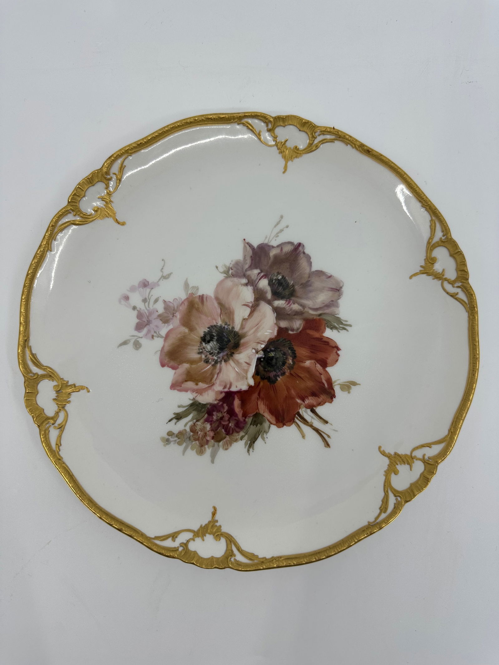 Antique KPM porcelain plate of flowers: Flower plate, KPM Berlin, year letter for 1912, 1st choice, red imperial apple mark, soft painting with flowers, verso marked, rim with rocaille in relief, mat gilded, 8 3/4"Excellent condition, no ch