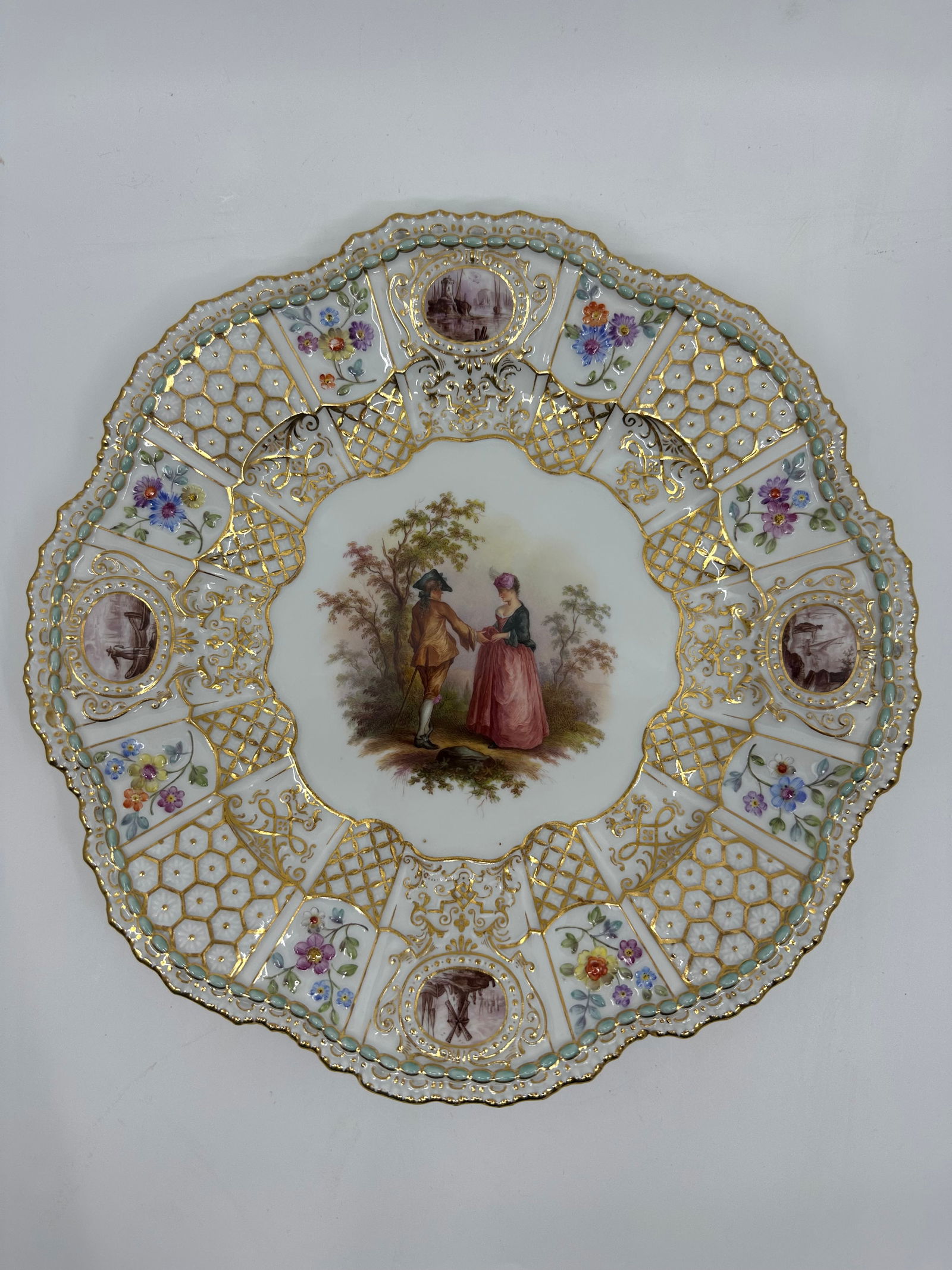 ANTIQUE MEISSEN PORCELAIN WATTEAU CABINET PLATE: ANTIQUE MEISSEN PORCELAIN CABINET PLATE. LATE 19TH CENTURY, BLUE CROSSED SWORDS MARKS, VARIOUS IMPRESSED NUMERALS. Finely painted Watteau scenes in a gilt border 9 3/4 in. diameter Condition Excellent