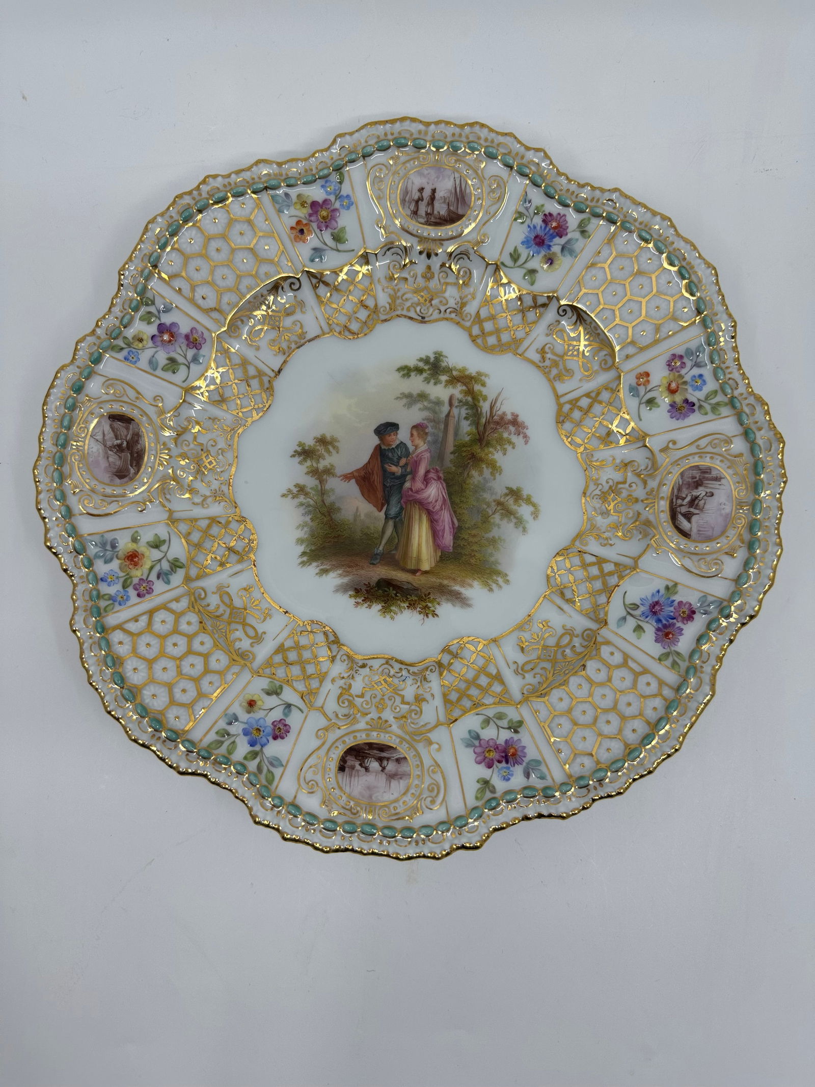 ANTIQUE MEISSEN PORCELAIN WATTEAU CABINET PLATE: ANTIQUE MEISSEN PORCELAIN CABINET PLATE. LATE 19TH CENTURY, BLUE CROSSED SWORDS MARKS, VARIOUS IMPRESSED NUMERALS. Finely painted Watteau scenes in a gilt border 9 3/4 in. diameter Condition Excellent