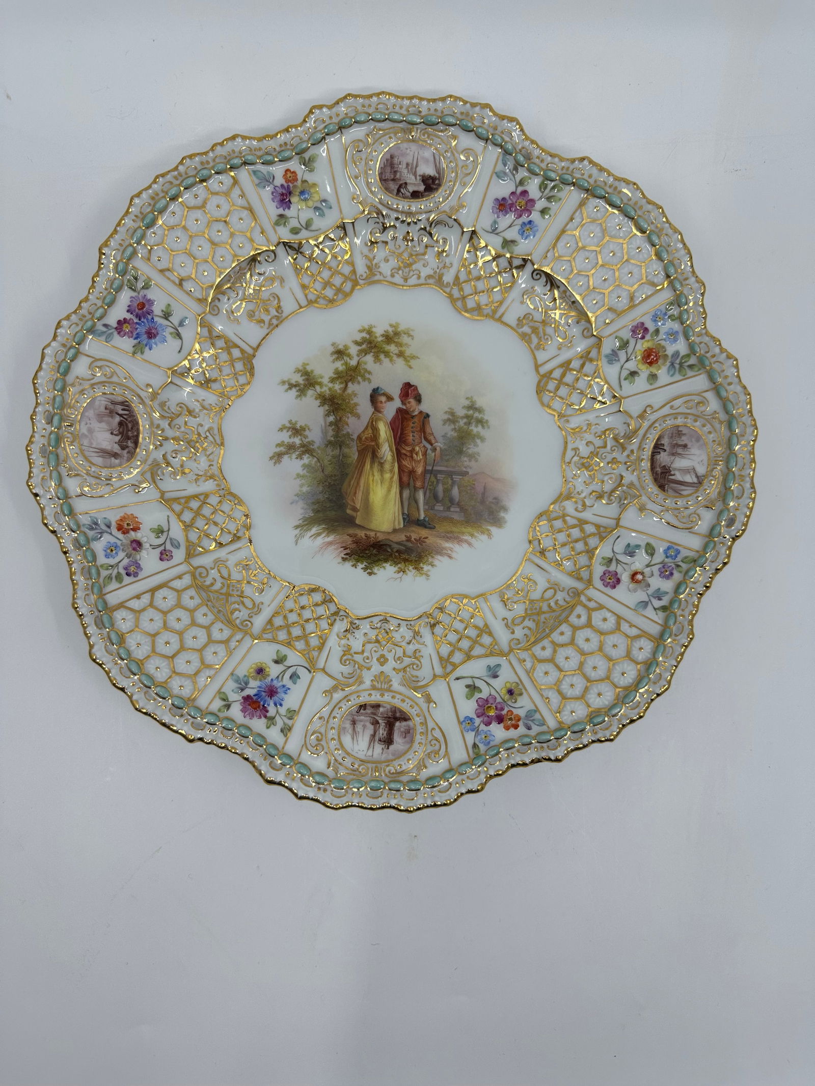 ANTIQUE MEISSEN PORCELAIN WATTEAU CABINET PLATE: ANTIQUE MEISSEN PORCELAIN CABINET PLATE. LATE 19TH CENTURY, BLUE CROSSED SWORDS MARKS, VARIOUS IMPRESSED NUMERALS. Finely painted Watteau scenes in a gilt border 9 3/4 in. diameter Condition Excellent