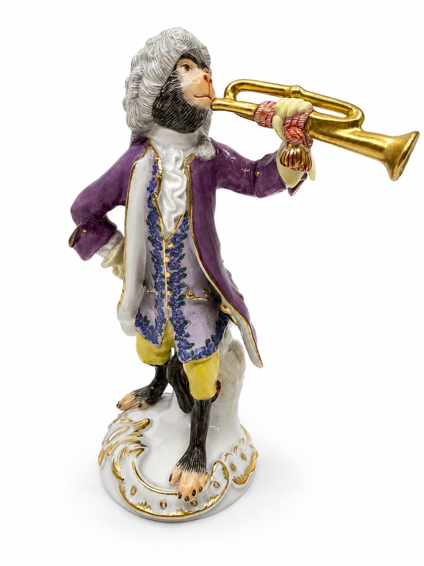 Meissen porcelain monkey band figure: DescriptionMeissen monkey band member playing a trumpet.Properly marked with Meissen crossed swords.Height 5 1/4 inches.Condition ReportExcellent condition, no chips or cracks