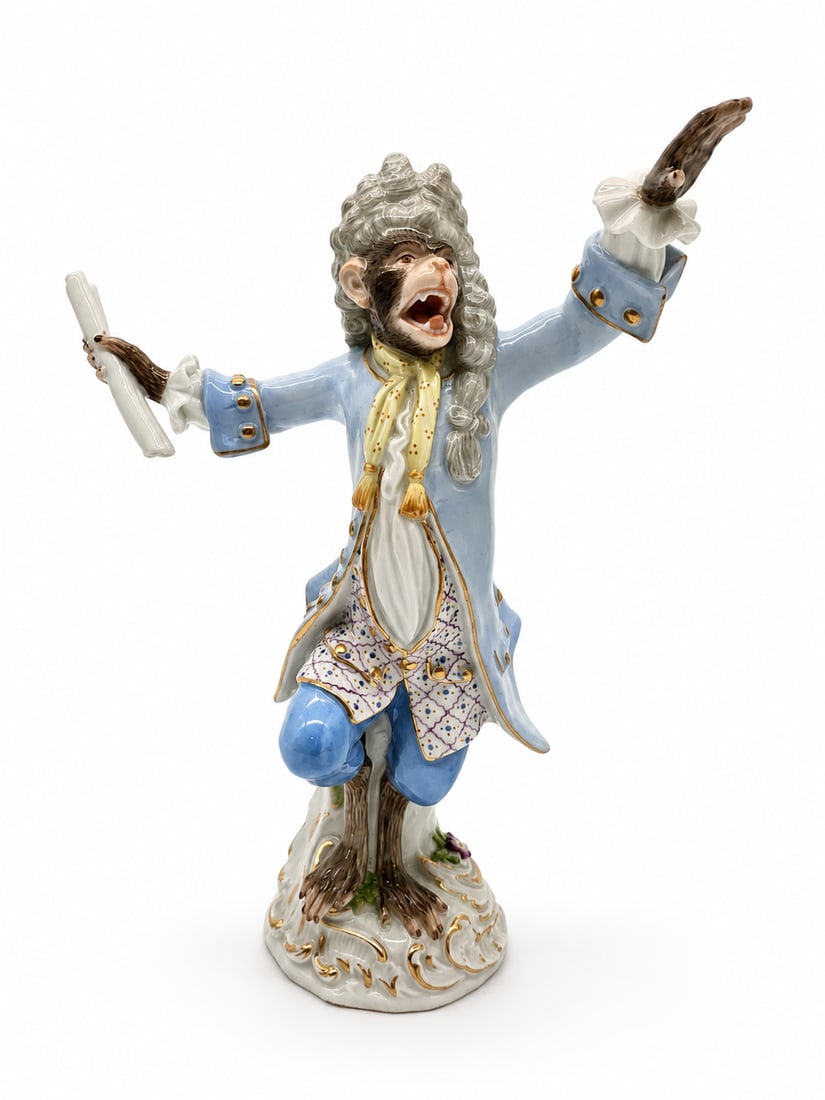 MEISSEN PORCELAIN MONKEY ORCHESTRA CONDUCTOR: German Meissen hand-painted porcelain figure, the conductor with music stand from the monkey band, after the model by Johann Joachim Kandler (1706-1775), 20th c., depicted in a powdered wig, pale