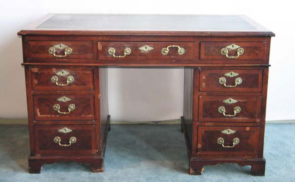 92: A 19th C Mahogany Double Pedestal Desk: A 19th C Mahogany Double Pedestal Desk with tooled leather insert to top, banded inlay to the center drawer and four drawers in each side, brass hardware, and bracket bases. 29"h, 47"w, 25"d.