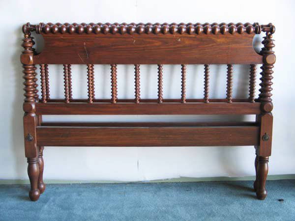 A Mixed Wood Double Bed: A Mixed Wood Double Bed with shaped and spool turned head and footboards and block and spool turned posts.