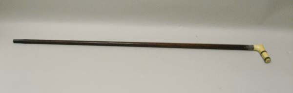 A Com. Oliver H. Perry Walking Stick,: with an ivory handle, metal bound and monogrammed SS, and having a silver collar engraved "Made from a Plank of the Flag Ship "Laurence", Commanded by Com. Oliver H. Perry in the Battle of Lake Erie S