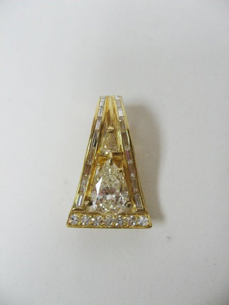 A Gold & Diamond Enhancer/Pendant,
