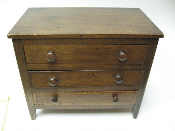 A Miniature Walnut Chest of Drawers,