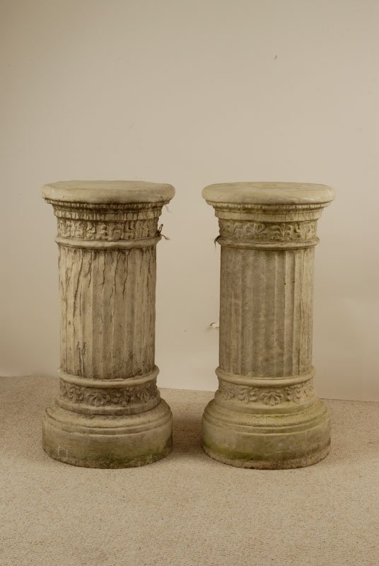 A Pair of Cast Garden Pedestals, having round tops