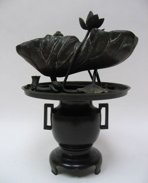 Two Bronze Floral Arrangement Vessels, one in the