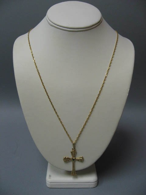 A Gold & Emerald Cross Pendant,