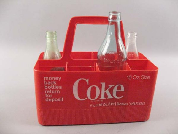 Coca Cola Plastic 16 oz. Carrier for 16 oz bottles: money back bottles return for deposit" with three bottles: Dr. Pepper, 10 oz., Was-cott Ginger Ale, 16 oz., with paper label, Coca Cola, 6 oz."