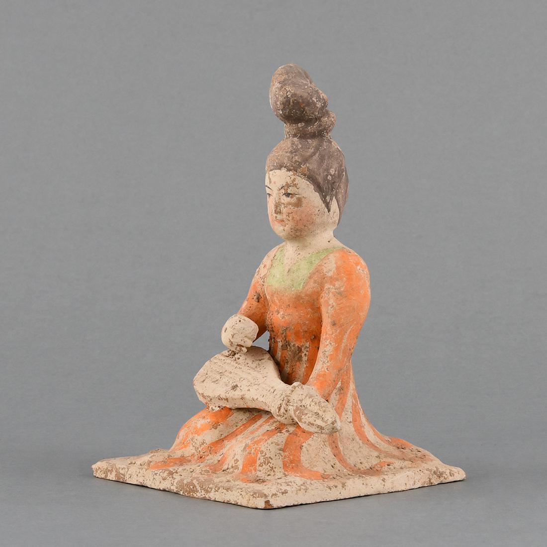 A PAINTED POTTERY FIGURE OF A MUSICIAN: A PAINTED POTTERY FIGURE OF A MUSICIANH:17.5cm,W:12.5cm