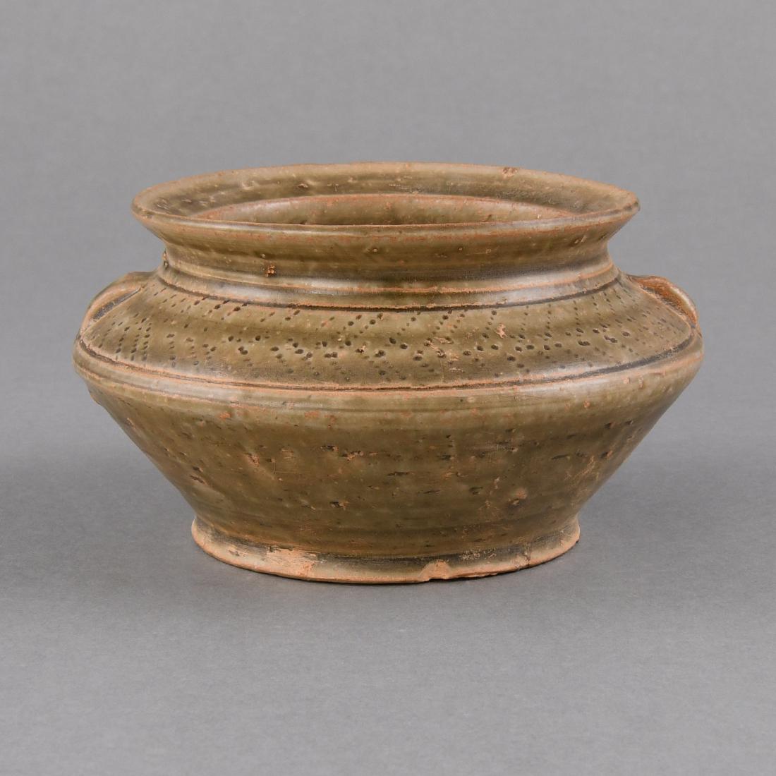 A 'YUE' CELADON-GLAZED STONEWARE JAR: A 'YUE' CELADON-GLAZED STONEWARE JAR Size: H:6.9cm,W:12.5cm,Diam.of mouth:10.2cm