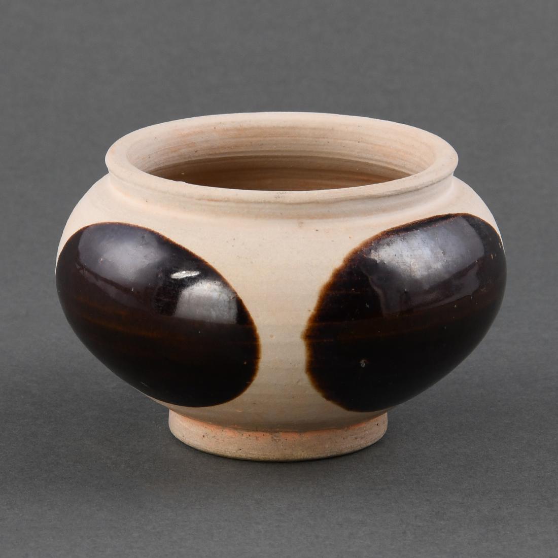 AN UNGLAZED PORCELAIN BLACK-PAINTED JAR (1 of 9)