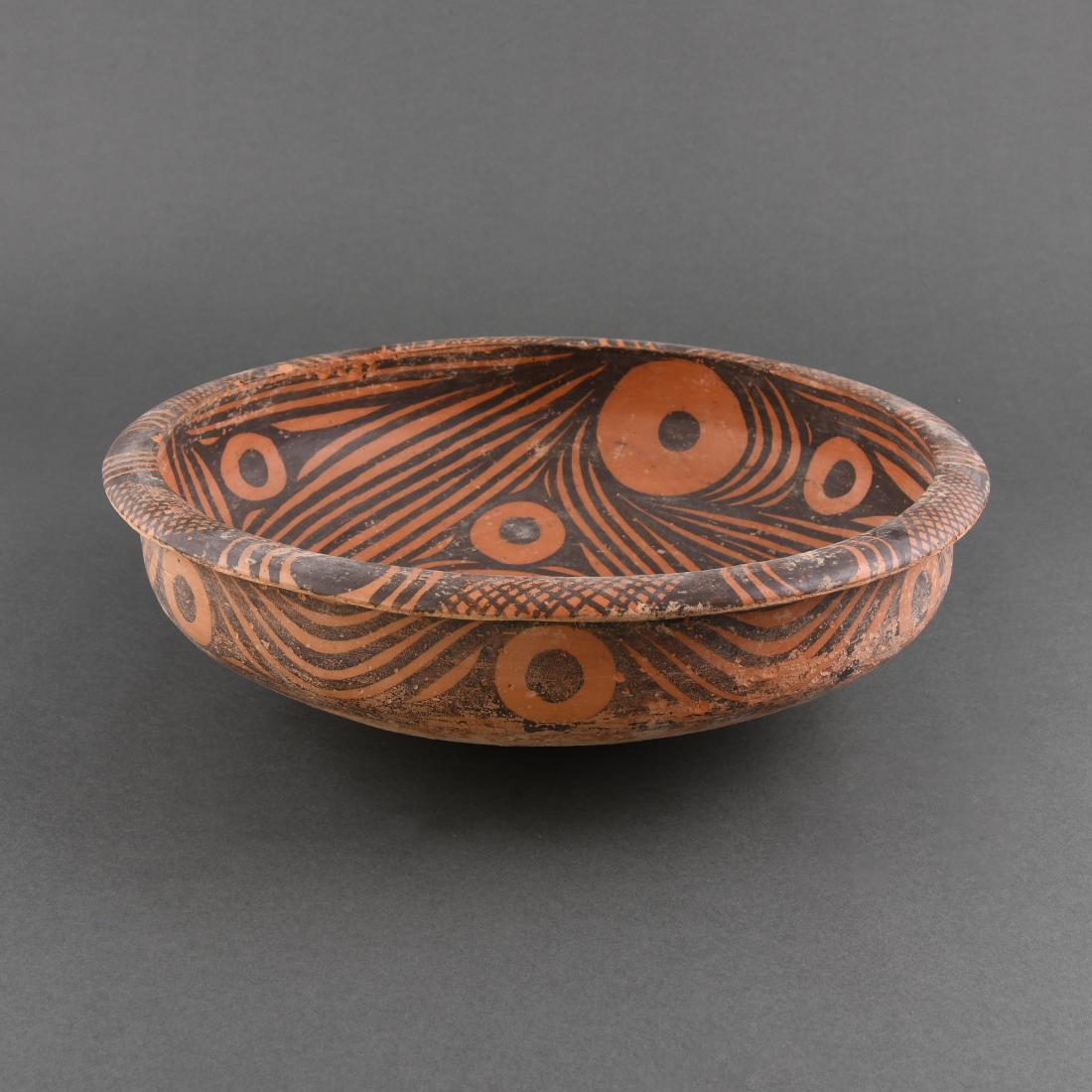 A LARGE 'MAJIAYAO' PAINTED POTTERY BASIN (1 of 9)