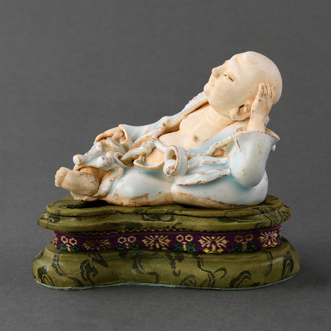 A RARE QINGBAI FIGURE OF A YOUNG BUDDHA (1 of 10)