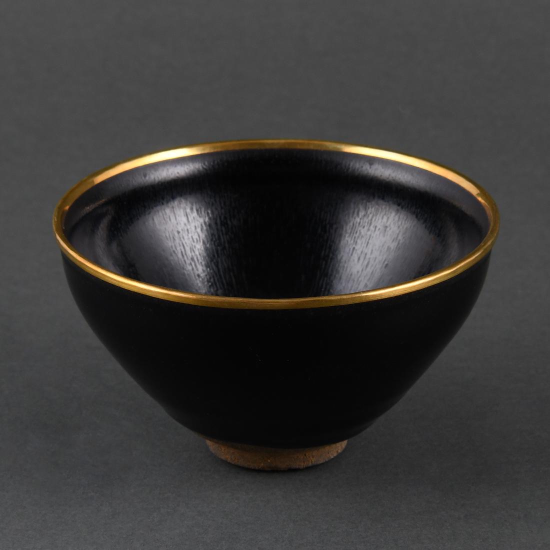 A BLACK-GLAZED 'HARE'S FUR' 'JIAN' TEABOWL: A BLACK-GLAZED 'HARE'S FUR' 'JIAN' TEABOWL, 'JINZHAN' MARK, the rim bound with gold metal Size: H:7.5cm,Dia:12.7cm