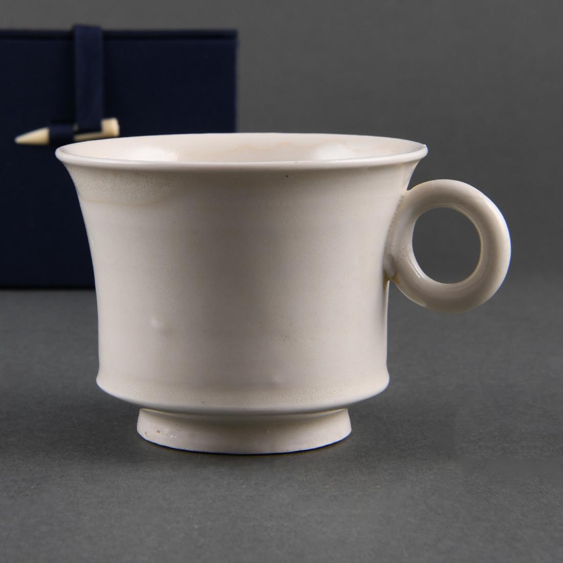 A 'XING' WHITE-GLAZED HANDLED CUP (1 of 11)