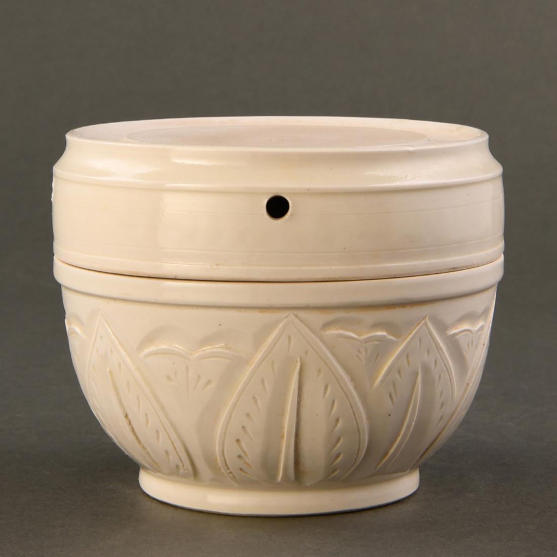 A 'DING' WHITE-GLAZED CARVED 'LOTUS' INKSTONE (1 of 8)