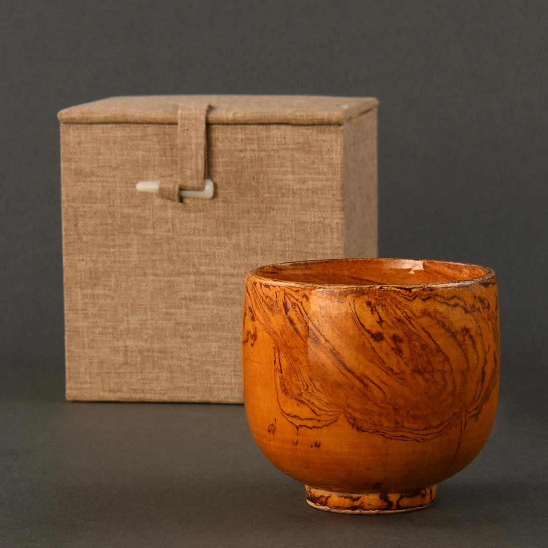 AN AMBER-GLAZED MARBLED CUP (1 of 9)