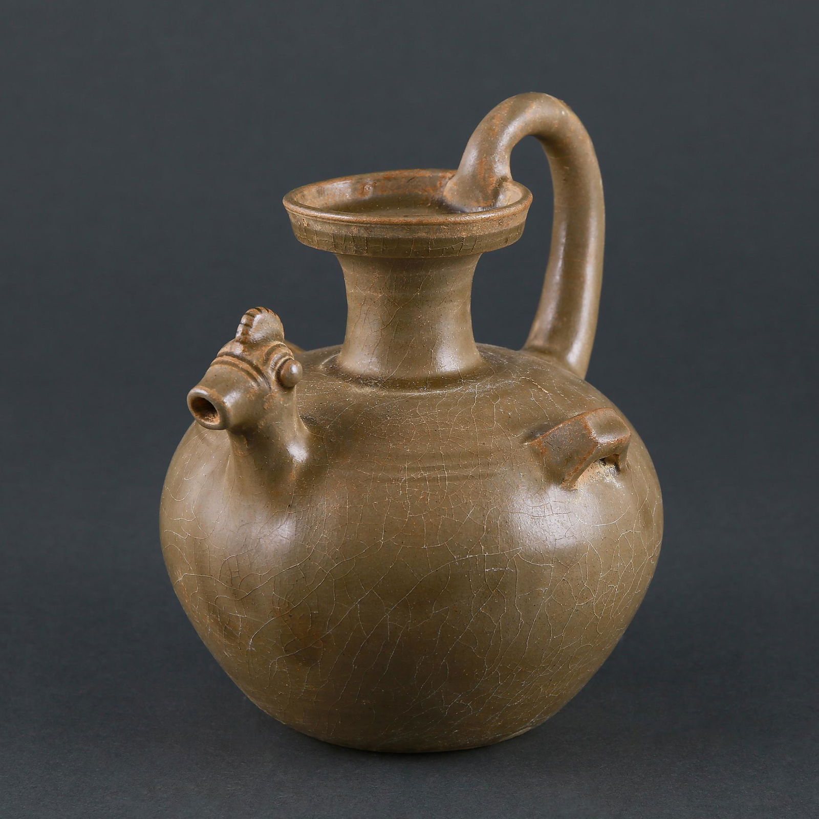 A RARE â€˜YUE' CELADON CHICKEN-HEAD EWER (1 of 6)